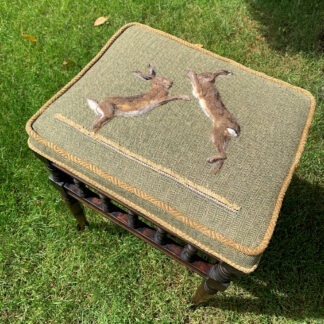 boxing hares on tweed piano stool